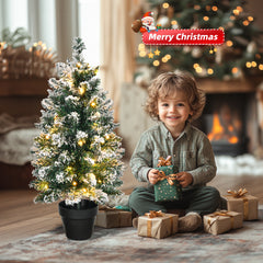 HAOYYE Premium Snow Flocked Pre-Lit Mini Christmas Tree with 30 Warm LED Lights, Small Tabletop Xmas Tree with Pot Base, Battery Operated for Home, Office, Store, Holiday Decorations, Festive Snowy Green